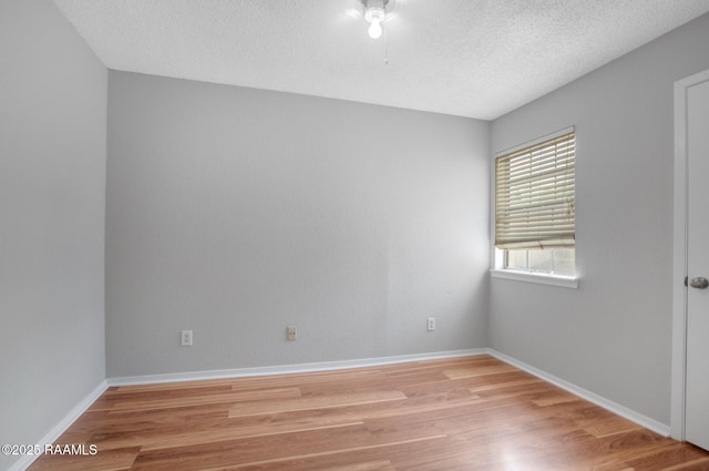 1304 E Bayou Pkwy Unit 4A, Lafayette, LA 70508 - unfurnished room featuring light wood-style flooring, a textured ceiling, and baseboards