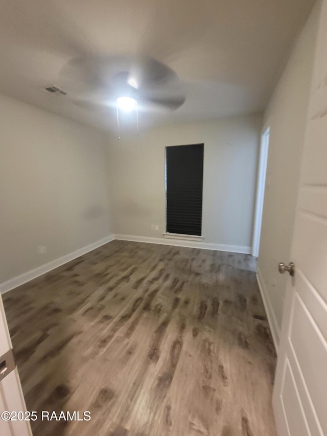 313 Harvest Ln, Abbeville, LA 70510 - spare room featuring wood finished floors, baseboards, and ceiling fan