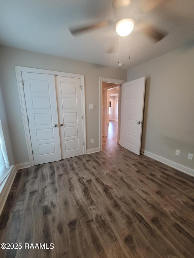 313 Harvest Ln, Abbeville, LA 70510 - unfurnished bedroom with wood finished floors, baseboards, a closet, and ceiling fan