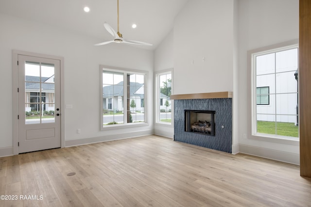 104 Wishing Well Dr, Broussard, LA 70518 - unfurnished living room featuring a ceiling fan, light wood-style flooring, high vaulted ceiling, plenty of natural light, and recessed lighting