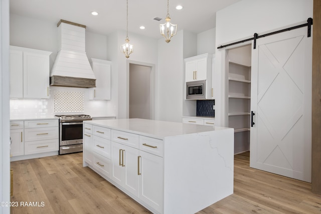 104 Wishing Well Dr, Broussard, LA 70518 - kitchen with stainless steel appliances, custom exhaust hood, backsplash, a barn door, and white cabinets