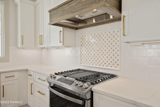 104 Wishing Well Dr, Broussard, LA 70518 - kitchen with gas stove, premium range hood, white cabinetry, and backsplash