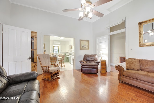 307 N Market St, Opelousas, LA 70570 - living room featuring a ceiling fan, wood finished floors, and ornamental molding