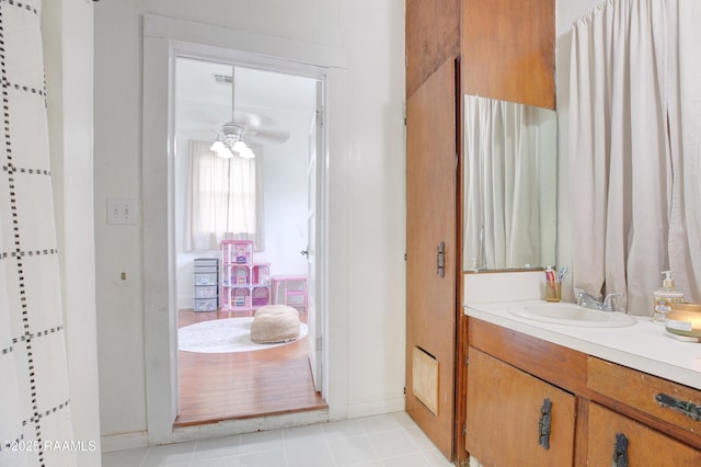 307 N Market St, Opelousas, LA 70570 - full bathroom featuring vanity, a ceiling fan, baseboards, and tile patterned floors