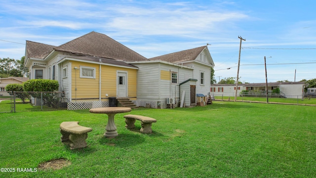 307 N Market St, Opelousas, LA 70570 - back of house featuring entry steps and a shingled roof