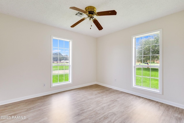421 Plantation Rd, Opelousas, LA 70570 - spare room featuring wood finished floors, healthy amount of natural light, and ceiling fan