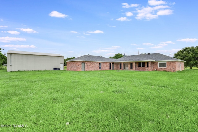 421 Plantation Rd, Opelousas, LA 70570 - rear view of house with a lawn