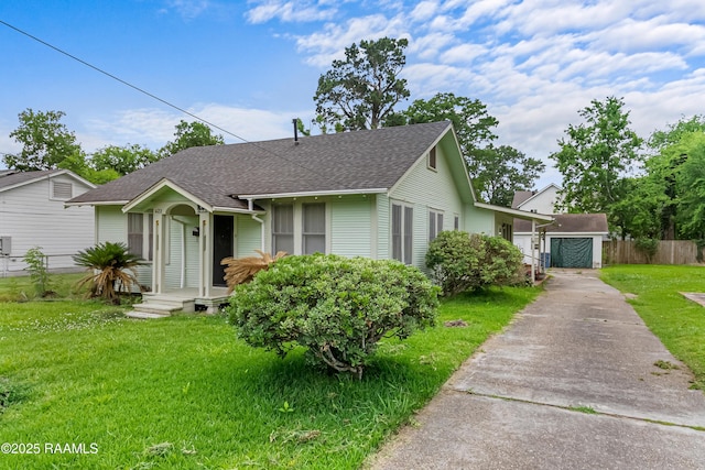 423 E 1st St, Jennings, LA 70546 - view of front of house with a shingled roof and concrete driveway