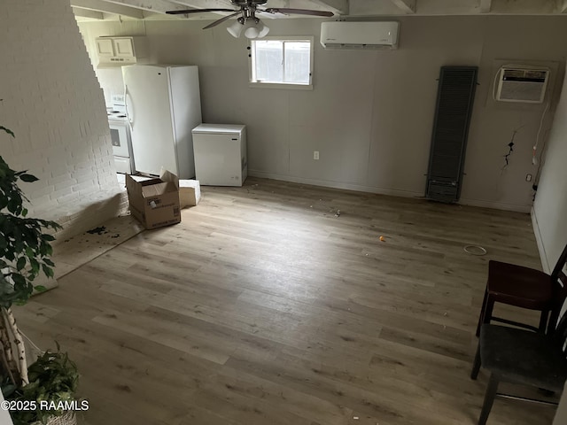 113 Fred St, Lafayette, LA 70501 - basement with a heating unit, freestanding refrigerator, fridge, light wood finished floors, and ceiling fan