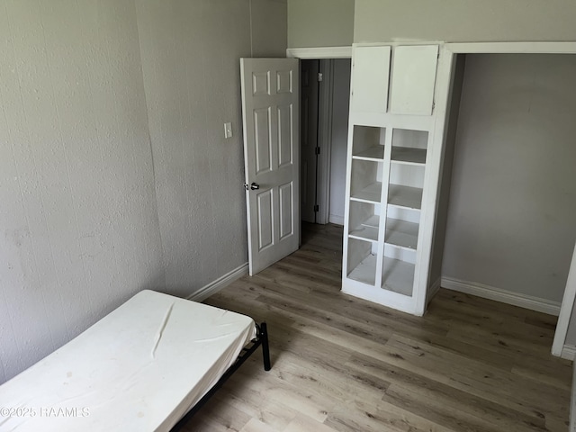 113 Fred St, Lafayette, LA 70501 - bedroom with wood finished floors and baseboards