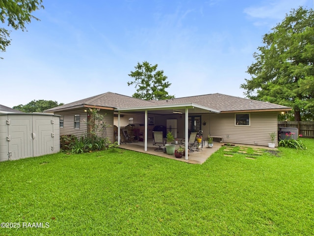 304 Bull Run Cir, Broussard, LA 70518 - rear view of property featuring a patio area, a storage unit, and roof with shingles