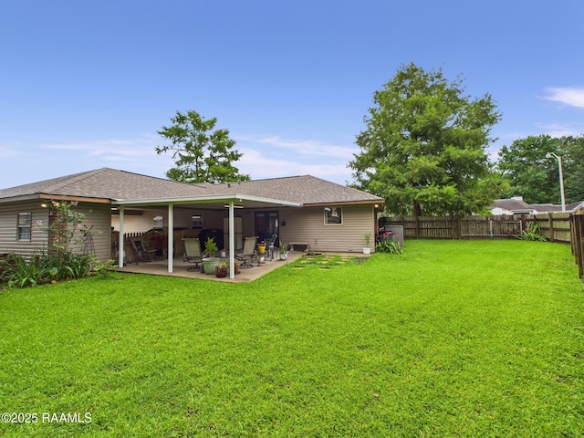 304 Bull Run Cir, Broussard, LA 70518 - rear view of house featuring a fenced backyard, a patio area, and a shingled roof