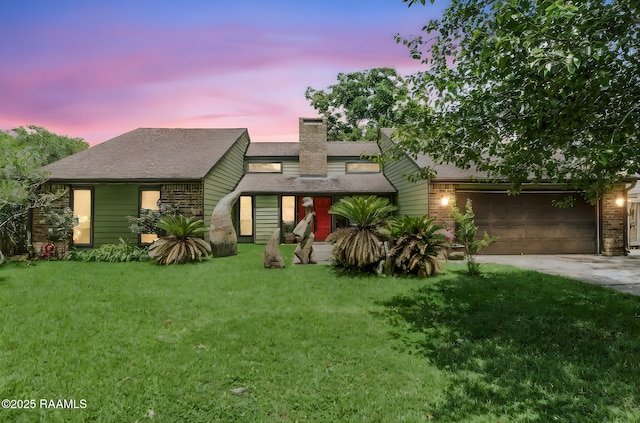146 Steiner Rd, Lafayette, LA 70508 - mid-century home with concrete driveway, an attached garage, a front yard, and a chimney