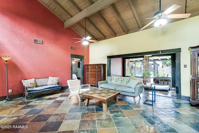 146 Steiner Rd, Lafayette, LA 70508 - living area with stone tile floors, wooden ceiling with exposed beams, a ceiling fan, high vaulted ceiling, and baseboards