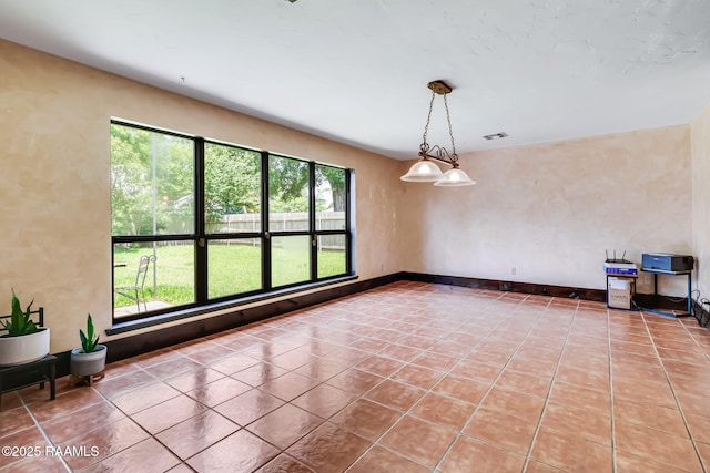 146 Steiner Rd, Lafayette, LA 70508 - spare room with plenty of natural light and light tile patterned floors