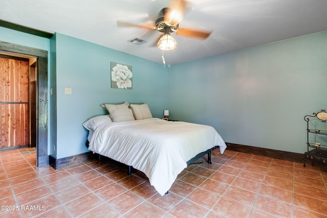 146 Steiner Rd, Lafayette, LA 70508 - bedroom with baseboards, tile patterned floors, and ceiling fan
