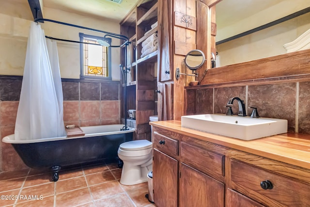 146 Steiner Rd, Lafayette, LA 70508 - full bathroom with tile walls, toilet, tile patterned flooring, shower / bath combination with curtain, and vanity