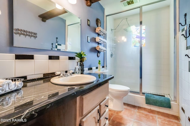 146 Steiner Rd, Lafayette, LA 70508 - full bathroom with vanity, a stall shower, toilet, and tile patterned floors