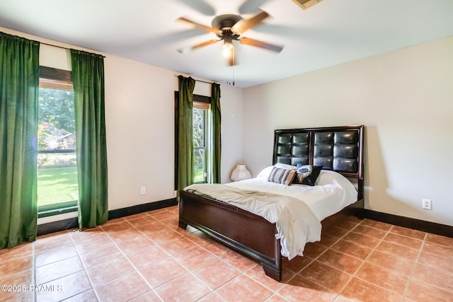146 Steiner Rd, Lafayette, LA 70508 - bedroom with light tile patterned flooring, baseboards, and ceiling fan