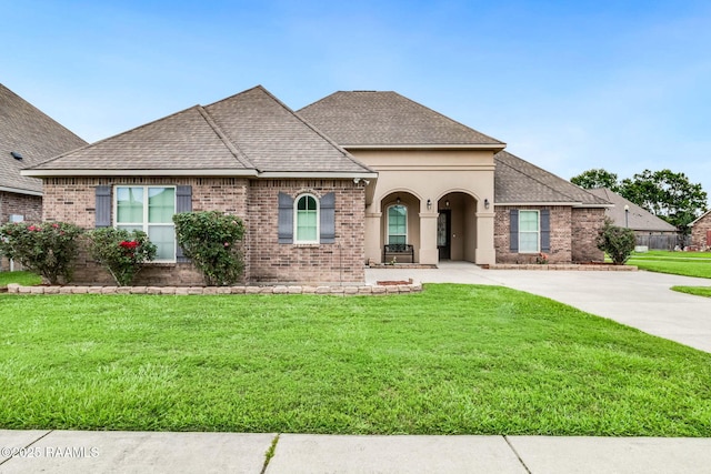 123 Angel Rock Ln, Broussard, LA 70518 - french country inspired facade with brick siding, a front lawn, and roof with shingles