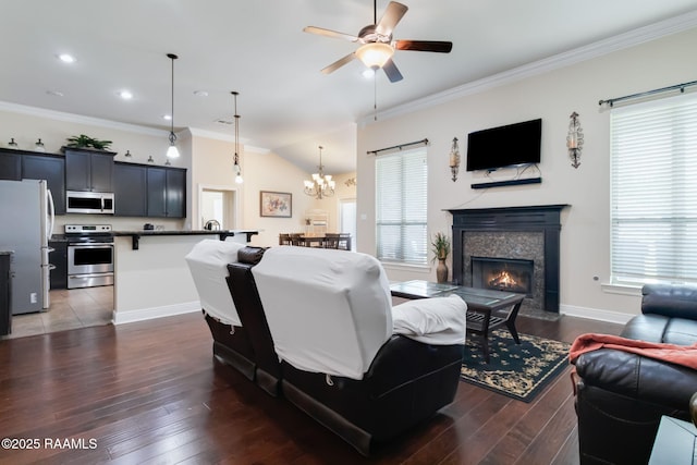 123 Angel Rock Ln, Broussard, LA 70518 - living room with dark wood-type flooring, a ceiling fan, crown molding, a chandelier, and baseboards
