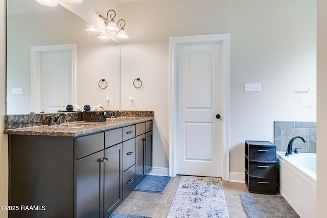 123 Angel Rock Ln, Broussard, LA 70518 - bathroom with double vanity, a garden tub, tile patterned floors, and baseboards