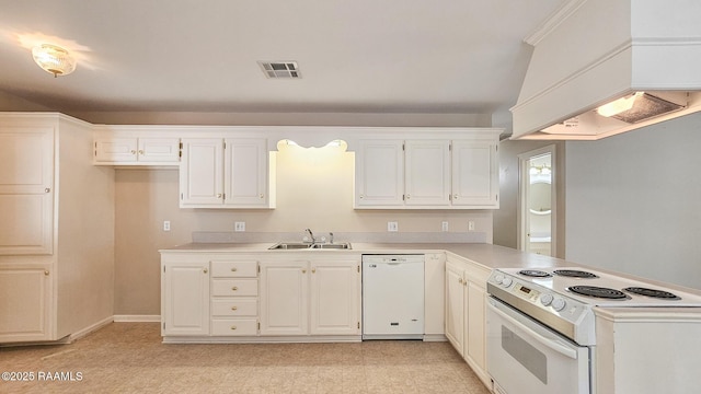 113 Jeanne St, Eunice, LA 70535 - kitchen featuring white appliances, premium range hood, a sink, light countertops, and a peninsula