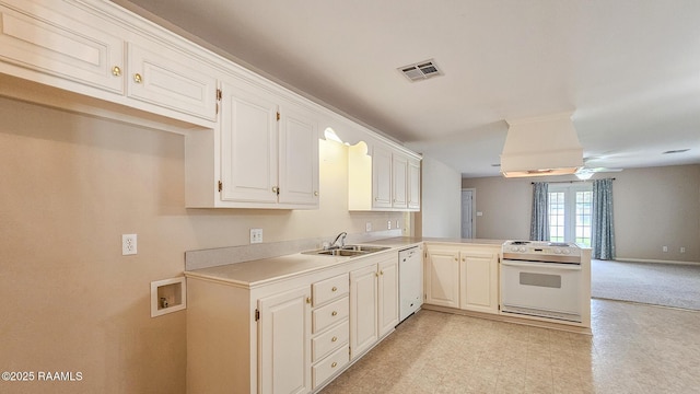 113 Jeanne St, Eunice, LA 70535 - kitchen with white appliances, a sink, a peninsula, light countertops, and open floor plan
