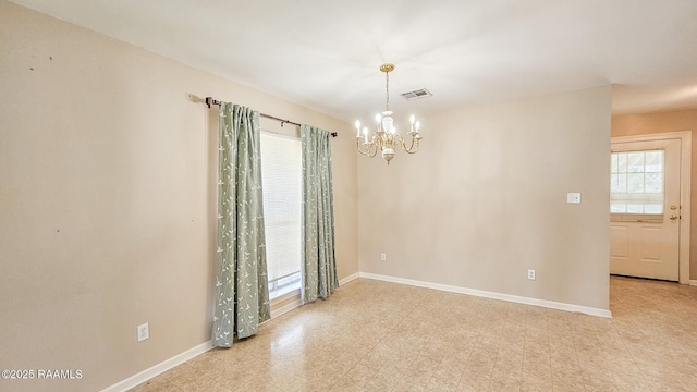 113 Jeanne St, Eunice, LA 70535 - spare room with a chandelier and baseboards