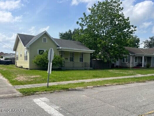 201 Allen St, New Iberia, LA 70563 - view of front of house with a porch and a front lawn