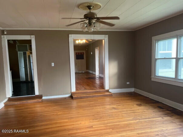 201 Allen St, New Iberia, LA 70563 - unfurnished room with crown molding, light wood-style floors, ceiling fan, and baseboards