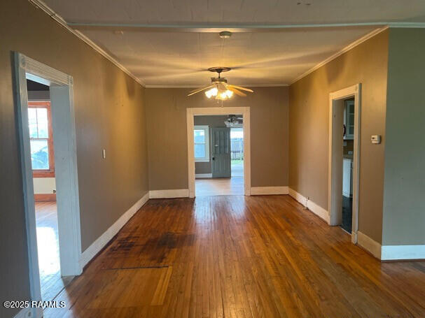 201 Allen St, New Iberia, LA 70563 - unfurnished room with ornamental molding, hardwood / wood-style floors, healthy amount of natural light, ceiling fan, and baseboards