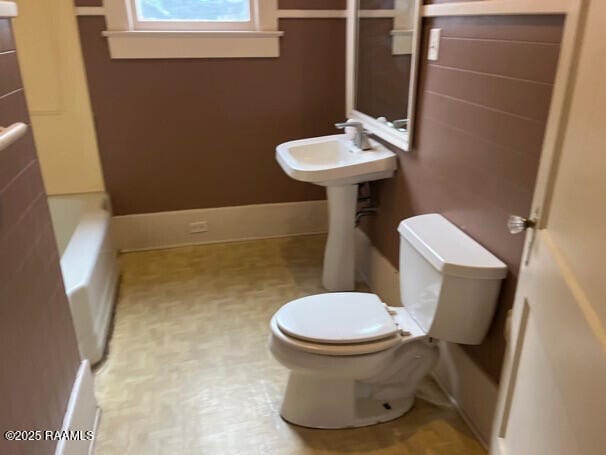 201 Allen St, New Iberia, LA 70563 - bathroom with toilet and a tub