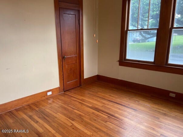 201 Allen St, New Iberia, LA 70563 - unfurnished room featuring wood finished floors, healthy amount of natural light, and baseboards