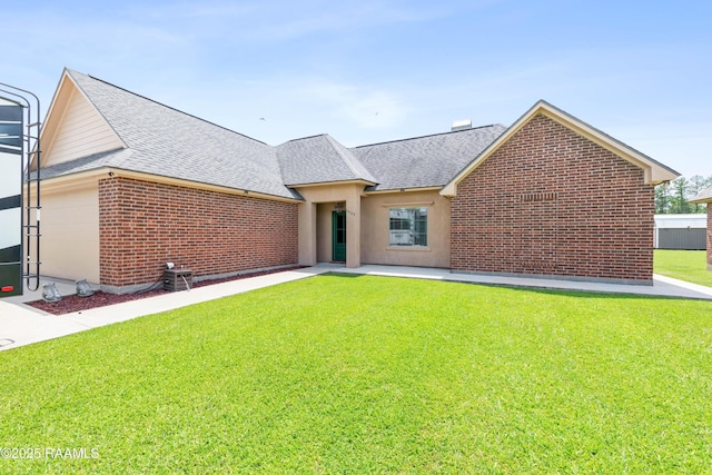 1117 Jules Broussard Rd, Breaux Bridge, LA 70517 - view of front of house featuring a shingled roof, a front yard, and brick siding