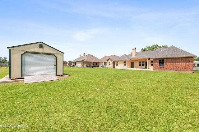1117 Jules Broussard Rd, Breaux Bridge, LA 70517 - view of green lawn with an outdoor structure