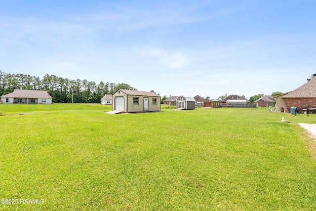 1117 Jules Broussard Rd, Breaux Bridge, LA 70517 - view of grassy yard with a detached garage