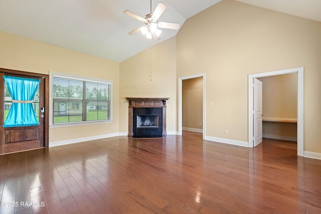 1117 Jules Broussard Rd, Breaux Bridge, LA 70517 - unfurnished living room with ceiling fan, high vaulted ceiling, a fireplace with flush hearth, wood finished floors, and baseboards