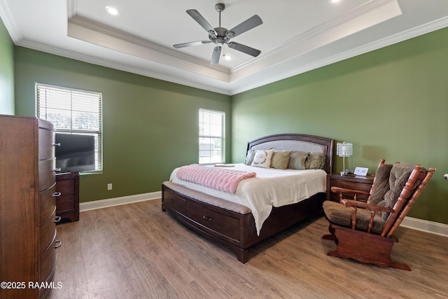 1117 Jules Broussard Rd, Breaux Bridge, LA 70517 - bedroom featuring a tray ceiling, ornamental molding, wood finished floors, baseboards, and recessed lighting