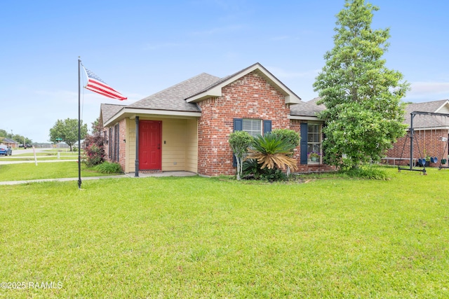 320 Golden Grain, Duson, LA 70529 - view of front of house with roof with shingles and brick siding