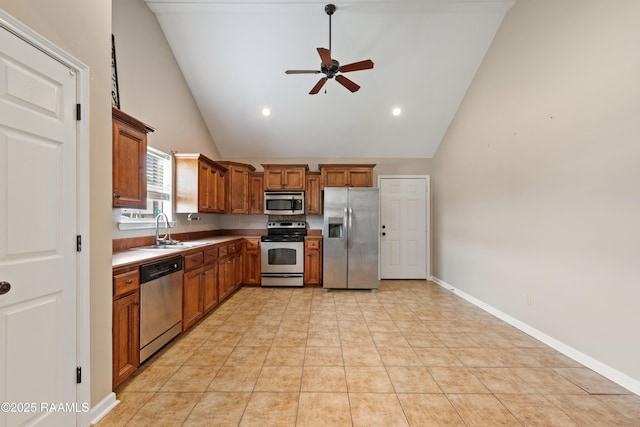 320 Golden Grain, Duson, LA 70529 - kitchen featuring appliances with stainless steel finishes, a sink, ceiling fan, high vaulted ceiling, and brown cabinetry