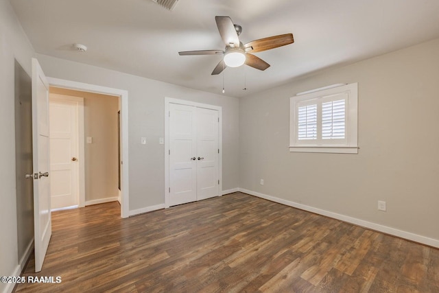 115 Hiawatha Rd, Lafayette, LA 70501 - unfurnished bedroom featuring wood finished floors, baseboards, a closet, and a ceiling fan