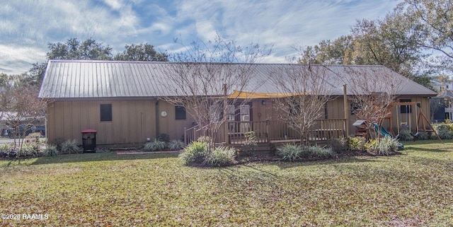 115 Hiawatha Rd, Lafayette, LA 70501 - rear view of house with a yard, metal roof, and a deck
