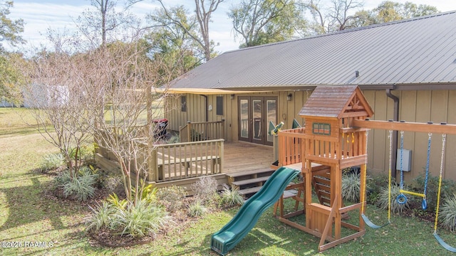115 Hiawatha Rd, Lafayette, LA 70501 - view of playground featuring french doors, a lawn, and a wooden deck