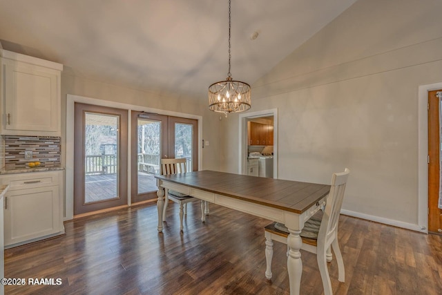 115 Hiawatha Rd, Lafayette, LA 70501 - dining space with independent washer and dryer, french doors, a chandelier, dark wood-type flooring, and lofted ceiling