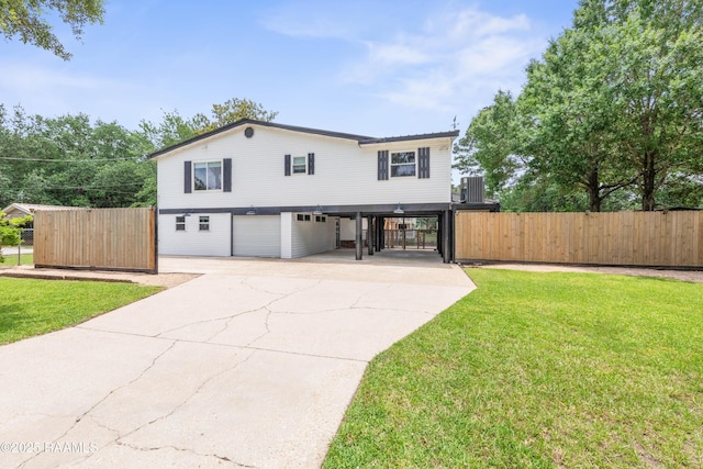 4802 Lafitte St, New Iberia, LA 70560 - view of front of property featuring concrete driveway, an attached garage, central air condition unit, and a carport