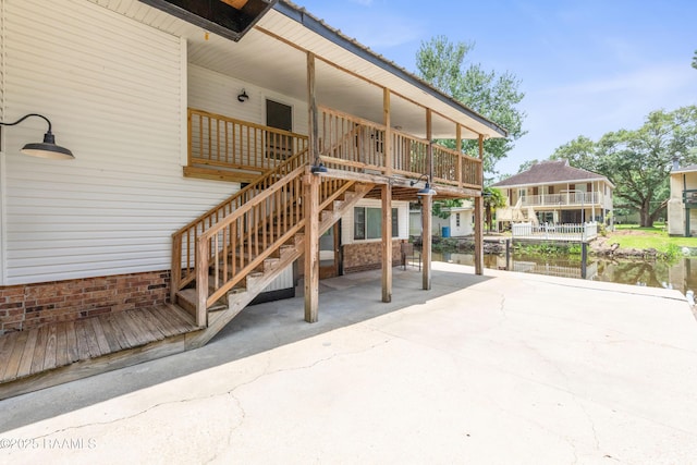 4802 Lafitte St, New Iberia, LA 70560 - view of patio / terrace featuring a water view and stairway