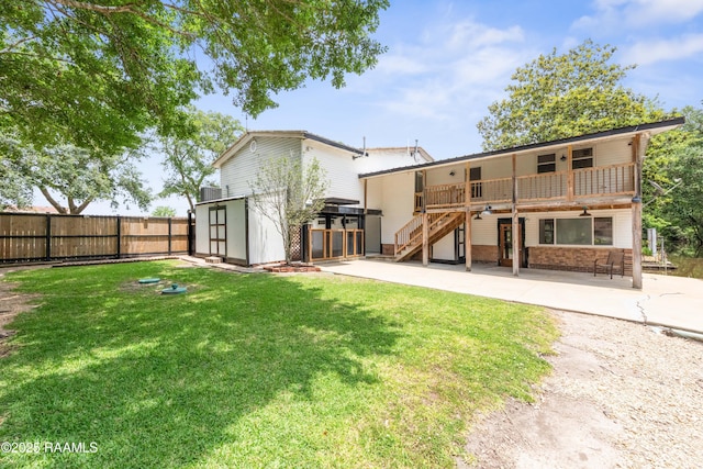 4802 Lafitte St, New Iberia, LA 70560 - back of house with a patio area, stairway, and central AC unit