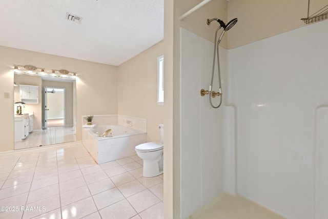 4802 Lafitte St, New Iberia, LA 70560 - bathroom featuring a shower, tile patterned flooring, a garden tub, toilet, and vanity