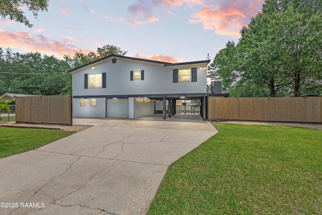4802 Lafitte St, New Iberia, LA 70560 - view of front of property with concrete driveway, a carport, and an attached garage